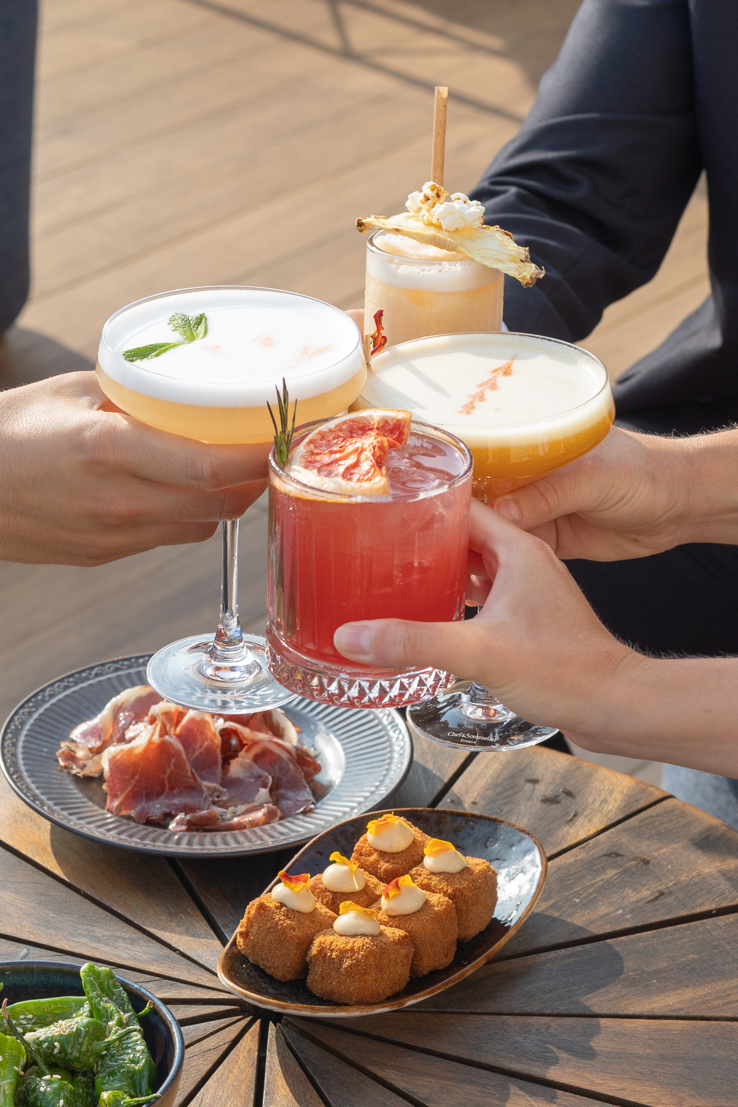 Cocktails and starters to share at sunset time